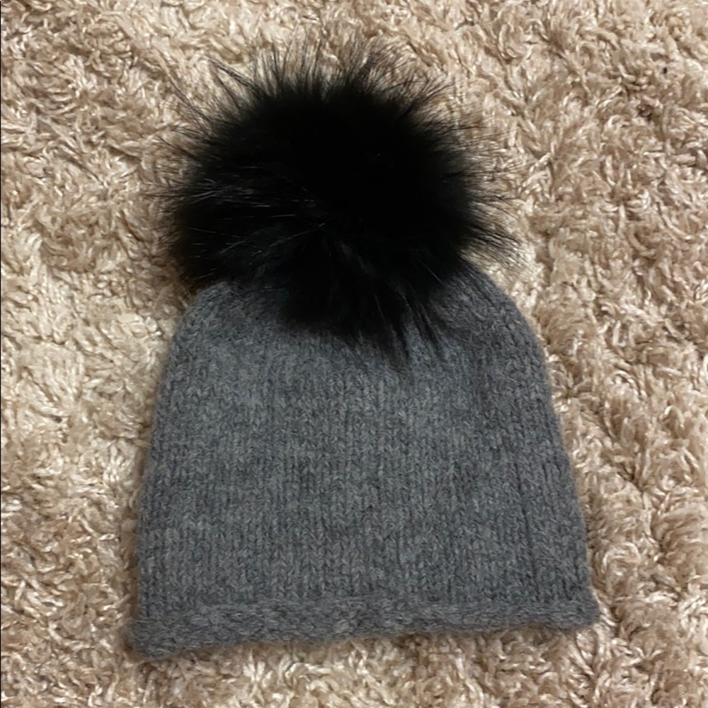 Pom Pom hat with real animal fur puff ball.